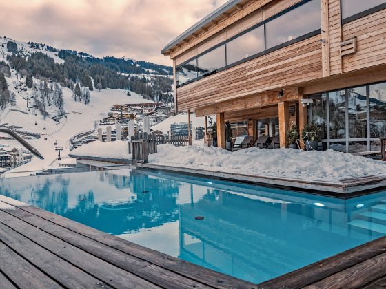 wellnesshotel saalbach hinterglemm outdoor pool winter 1